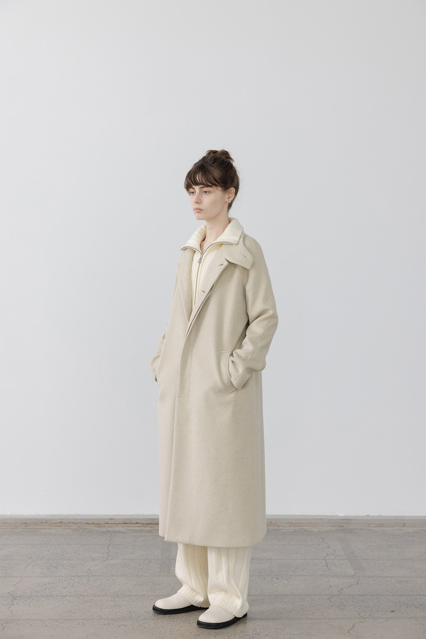 High neck stand collar over long coat 