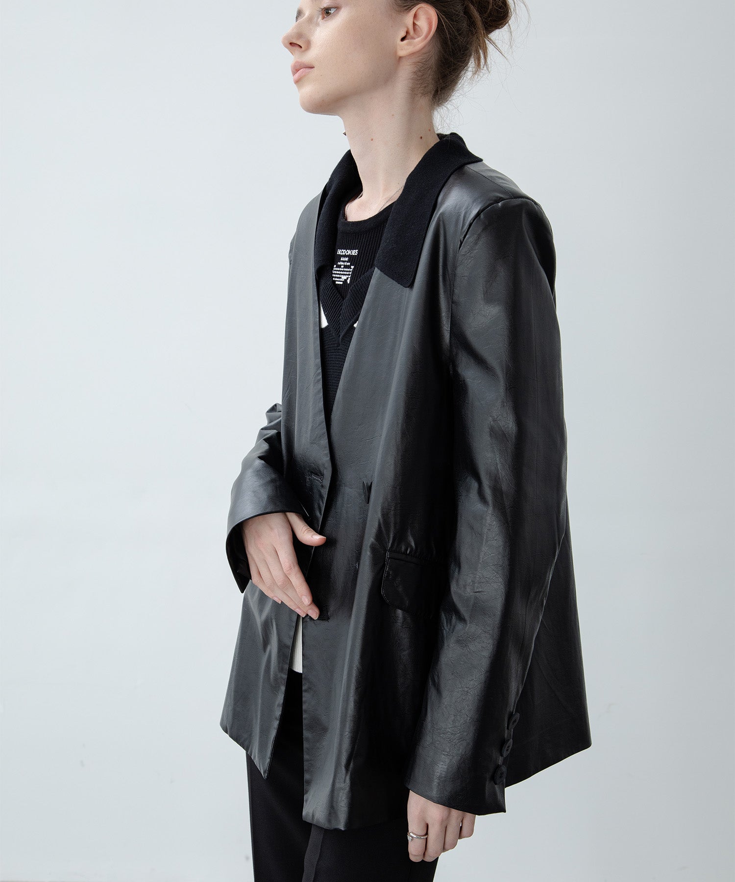 Faux leather double-breasted collarless jacket